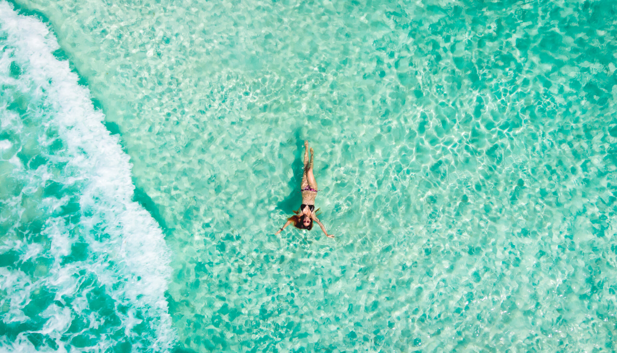 Young,Woman,Floating,In,The,Clear,Sea,Of,The,Mexican