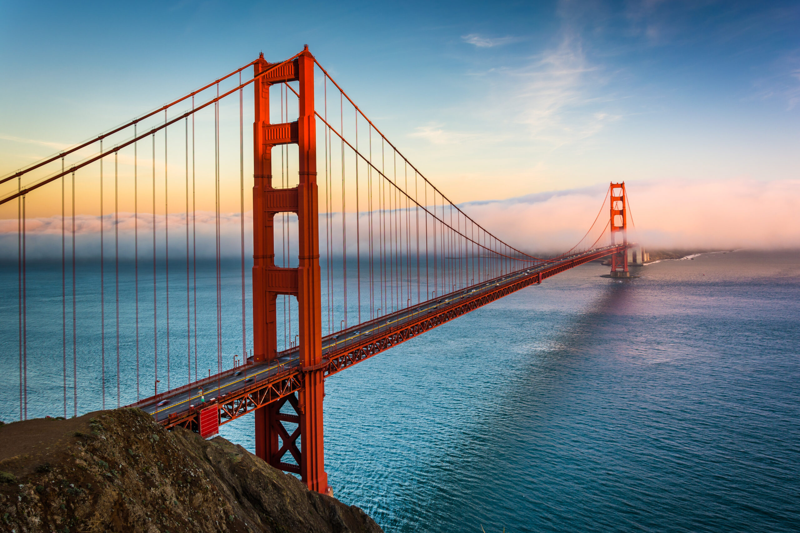 Sunset,View,Of,The,Golden,Gate,Bridge,And,Fog,From